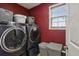 Laundry room with modern appliances and natural light from the window at 1221 Fountain Head Ct, Lawrenceville, GA 30043