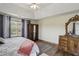 Spacious main bedroom features a tray ceiling, hardwood floors, and large windows for ample natural light at 1221 Fountain Head Ct, Lawrenceville, GA 30043