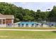 Community pool with lounge chairs and a well-maintained green space at 1221 Fountain Head Ct, Lawrenceville, GA 30043