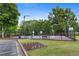 Outdoor basketball court with benches and bike rack, surrounded by lush greenery in a well-maintained community at 1820 Hunters Moon Dr, Alpharetta, GA 30005