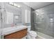 Modern bathroom with glass enclosed shower, sleek fixtures and wood vanity at 1820 Hunters Moon Dr, Alpharetta, GA 30005