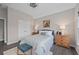 Bedroom featuring wood floors, a ceiling fan, and a large double door closet at 1820 Hunters Moon Dr, Alpharetta, GA 30005