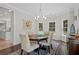 Inviting dining room with hardwood floors, chandelier and natural light at 1820 Hunters Moon Dr, Alpharetta, GA 30005