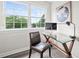 Bright home office featuring a glass desk and ergonomic chair, perfect for productivity at 1820 Hunters Moon Dr, Alpharetta, GA 30005