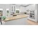 Modern kitchen features white cabinets, stainless steel appliances, and granite countertops at 1820 Hunters Moon Dr, Alpharetta, GA 30005
