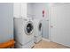 Functional laundry room with front load washer and dryer at 1820 Hunters Moon Dr, Alpharetta, GA 30005