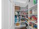 Organized walk-in pantry with lots of shelving for storage at 1820 Hunters Moon Dr, Alpharetta, GA 30005