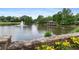 Scenic community pond with a fountain and covered gazebo offering serene waterfront views, ideal for relaxation at 1820 Hunters Moon Dr, Alpharetta, GA 30005