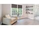 Comfortable sitting area with natural light, floating shelves and nearby bathroom at 1820 Hunters Moon Dr, Alpharetta, GA 30005
