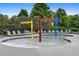 Community splash pad featuring colorful spray structures and lounge chairs, perfect for Gathering fun in the water at 1820 Hunters Moon Dr, Alpharetta, GA 30005