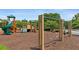 A well-maintained community playground offers swings and play structures for children, set on a safe mulch ground at 1820 Hunters Moon Dr, Alpharetta, GA 30005