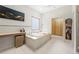 Elegant bathroom with a soaking tub, modern fixtures, and serene design at 35 Kenmare Hall Ne, Atlanta, GA 30324