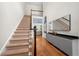 Inviting foyer with staircase, hardwood floors, and stylish decor at 35 Kenmare Hall Ne, Atlanta, GA 30324