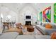 Bright living room with vaulted ceilings, fireplace, and contemporary furnishings at 35 Kenmare Hall Ne, Atlanta, GA 30324