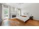 Relaxing main bedroom features hardwood floors, fireplace, and access to outdoor patio at 35 Kenmare Hall Ne, Atlanta, GA 30324