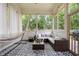 Relaxing screened porch features a comfortable seating and hammock at 35 Kenmare Hall Ne, Atlanta, GA 30324