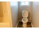 Bathroom with tile floors, neutral paint, and a toilet and tub with shower at 4016 Meadow Glen Way, Fairburn, GA 30213
