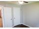 Bedroom with neutral paint, two closets and wood-look floors at 4016 Meadow Glen Way, Fairburn, GA 30213