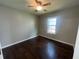 Bedroom with a ceiling fan, a window bringing in natural light, and wood-look flooring at 4016 Meadow Glen Way, Fairburn, GA 30213