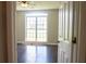 Bedroom featuring hardwood floors, natural light, and a ceiling fan at 4016 Meadow Glen Way, Fairburn, GA 30213