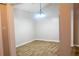 Dining area with light-colored walls, wood-look tile flooring and decorative chandelier at 4016 Meadow Glen Way, Fairburn, GA 30213