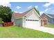 Lovely home featuring neutral siding and a well-maintained lawn, with a two-car garage for convenience at 4016 Meadow Glen Way, Fairburn, GA 30213