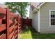 This side yard offers a path to the front yard and backyard with wood fence at 4016 Meadow Glen Way, Fairburn, GA 30213