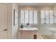Bright and airy bathroom featuring a makeup vanity and glass enclosed shower with seating at 4809 Highland Point Dr, Auburn, GA 30011