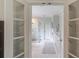 View into modern bathroom with glass enclosed shower and white vanity with double sinks at 4809 Highland Point Dr, Auburn, GA 30011