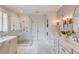 Bright bathroom featuring a glass shower, double vanity, and makeup vanity with natural light at 4809 Highland Point Dr, Auburn, GA 30011