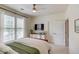 Well-lit bedroom with a bed, large window with blinds, and a modern ceiling fan at 4809 Highland Point Dr, Auburn, GA 30011