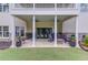 Covered patio featuring ceiling fans, stone accents, and comfortable seating for outdoor relaxation and entertaining at 4809 Highland Point Dr, Auburn, GA 30011