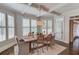 Charming dining room with a farmhouse table and decorative ceiling beams at 4809 Highland Point Dr, Auburn, GA 30011