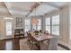 Elegant dining room with coffered ceilings, plantation shutters, and a stylish light fixture at 4809 Highland Point Dr, Auburn, GA 30011
