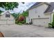 Driveway view featuring a detached garage, well-manicured landscaping, and ample parking space at 4809 Highland Point Dr, Auburn, GA 30011