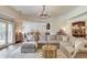 Bright living room with an open floorplan, hardwood floors and a large sectional couch at 4809 Highland Point Dr, Auburn, GA 30011