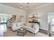Spacious living room with hardwood floors, staircase, and ample seating at 4809 Highland Point Dr, Auburn, GA 30011