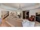 Open-concept living room with a cozy sofa, barn door, and plenty of natural light at 4809 Highland Point Dr, Auburn, GA 30011