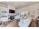 Open-concept living room featuring a fireplace, built-in shelving, and hardwood floors at 4809 Highland Point Dr, Auburn, GA 30011