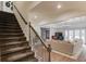 Spacious living room featuring a staircase, cozy seating area, and stylish lighting at 4809 Highland Point Dr, Auburn, GA 30011