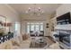 Bright and airy living room features fireplace, built-ins, and French doors leading to outdoor space at 4809 Highland Point Dr, Auburn, GA 30011
