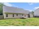 The backyard features a fenced perimeter, trampoline, and a charming outdoor patio at 220 Windpher Rdg, Hampton, GA 30228