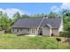 A sprawling backyard with a trampoline and fenced perimeter offers ample outdoor space at 220 Windpher Rdg, Hampton, GA 30228