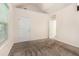 A carpeted bedroom shows a door leading to an adjoining space at 220 Windpher Rdg, Hampton, GA 30228