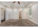 Spacious carpeted bedroom with neutral walls, ceiling fan, and multiple doorways at 220 Windpher Rdg, Hampton, GA 30228