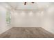 Bright bedroom featuring a vaulted ceiling, carpet, and neutral walls at 220 Windpher Rdg, Hampton, GA 30228