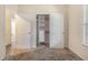 Carpeted bedroom showing a closet featuring shelving and drawers at 220 Windpher Rdg, Hampton, GA 30228