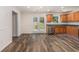 Bright kitchen with stainless steel appliances, wood cabinets, and backyard access at 220 Windpher Rdg, Hampton, GA 30228