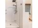 Modern shower with rainfall shower head and built-in shelving for toiletries at 220 Windpher Rdg, Hampton, GA 30228