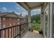 Spacious balcony showing wrought iron railing with a view of the building and surrounding trees at 2300 Peachford Rd # 3411, Dunwoody, GA 30338